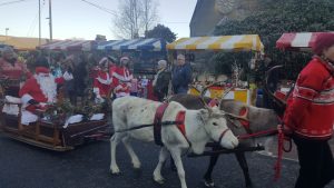 Image of Santa on a sleigh pulled by reindeer