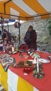Image of Heather with gift bag by stall